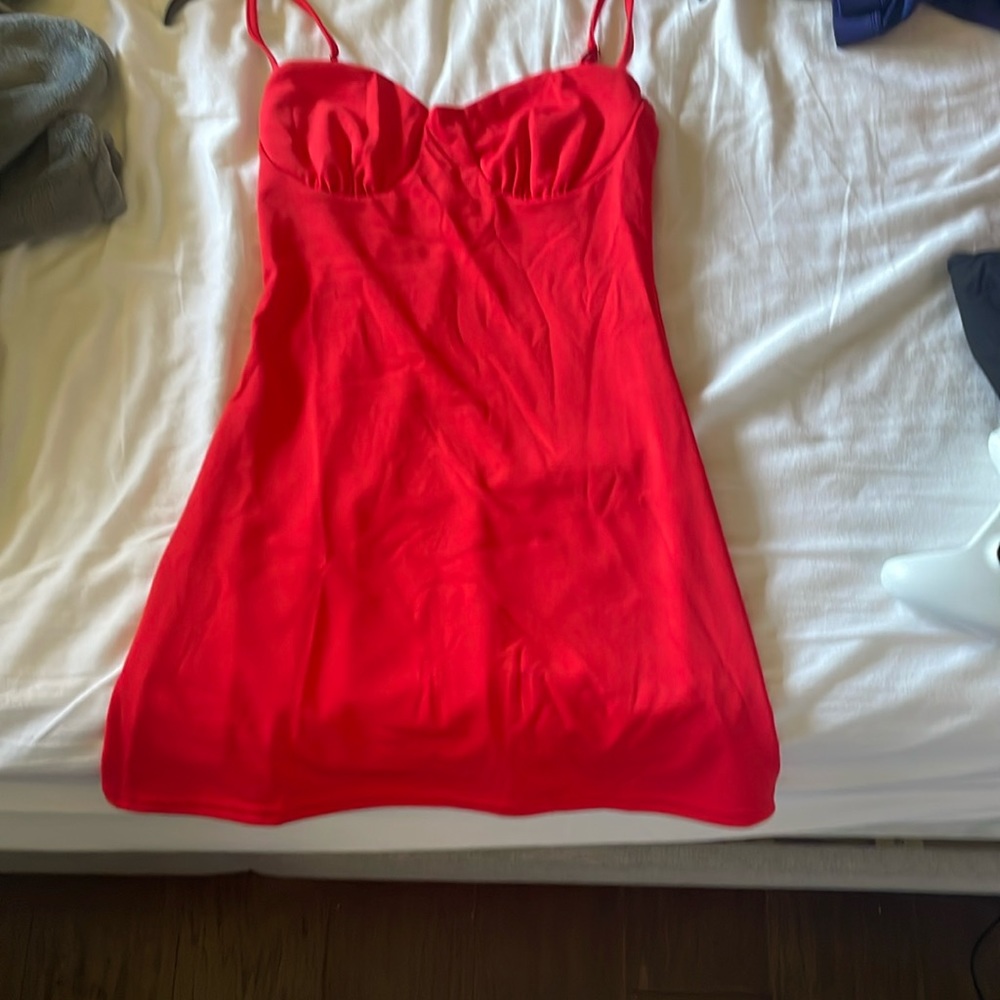 Small red dress from Amazon. 95% Polyester and 5% spandex.